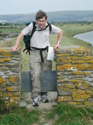 John climbing stile