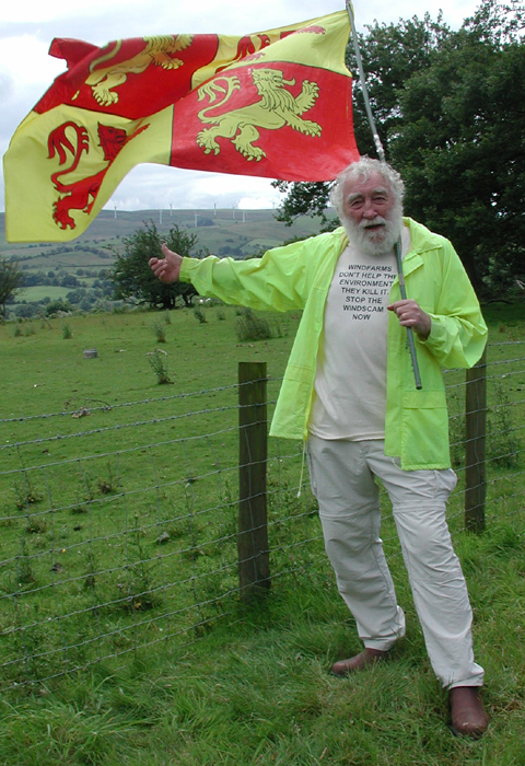 David Bellamy with the turbines behind